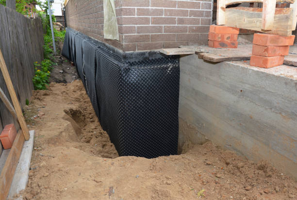 Happy homeowners after waterproofing job in Ohatchee